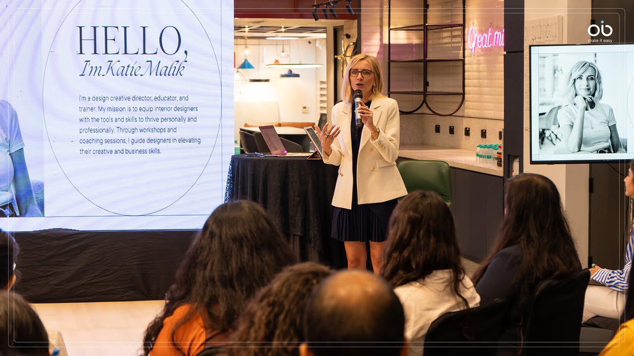 Katie Malik, interior design creative director, speaking at a professional workshop presenting her design business expertise to an audience of interior designers